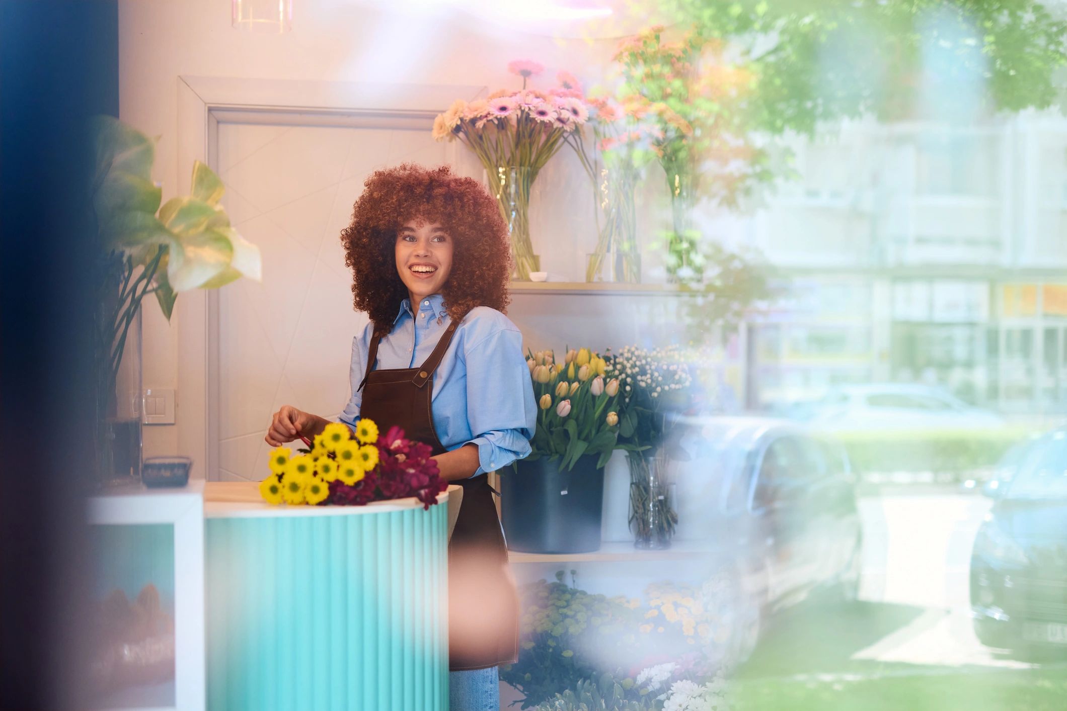 Florist arranging a colorful bouquet in a flower shop