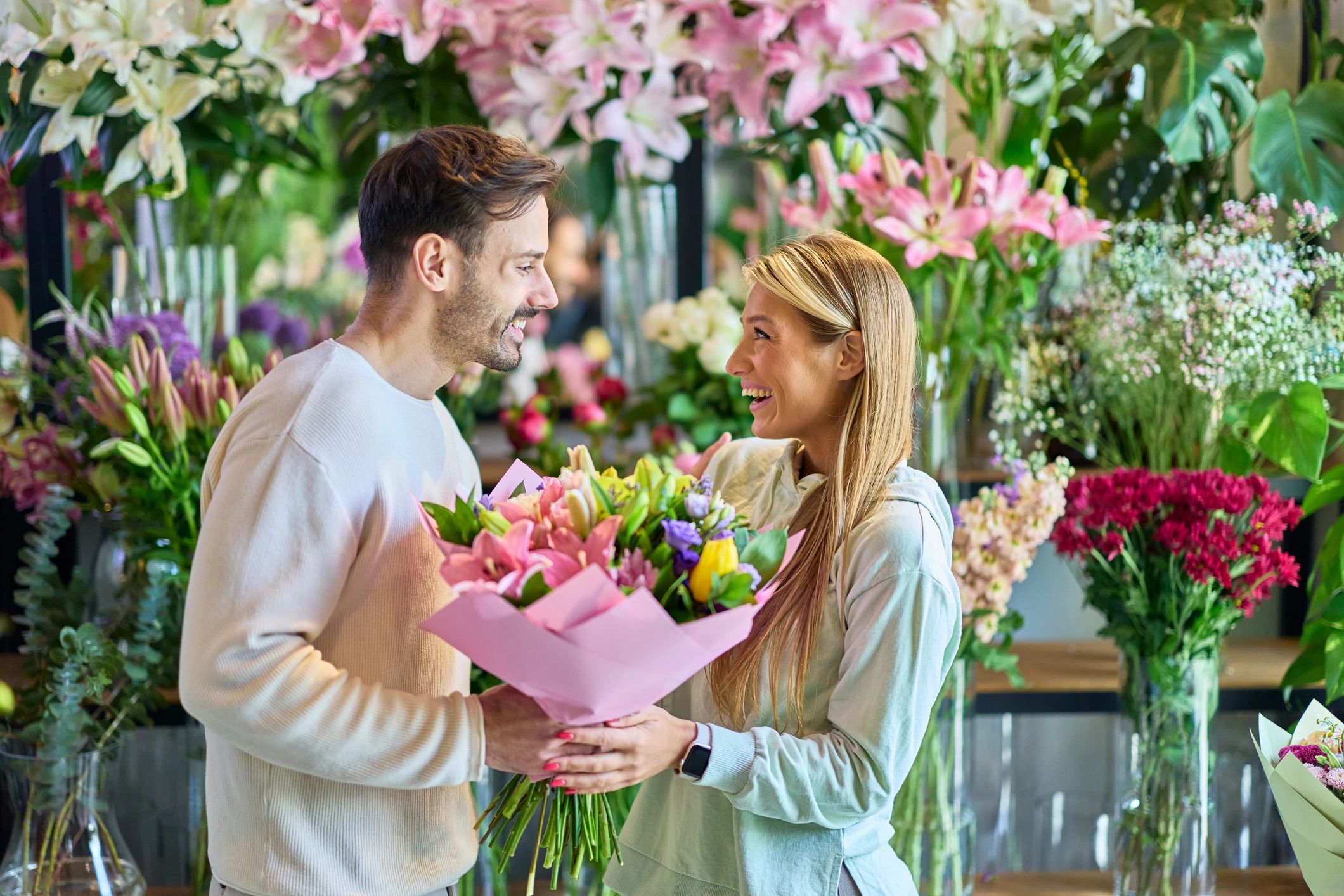 Customer receiving a bouquet in a flower shop